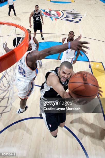 Tony Parker of the San Antonio Spurs shoots a layup against Jeff Green of the Oklahoma City Thunder at the Ford Center April 7, 2009 in Oklahoma...