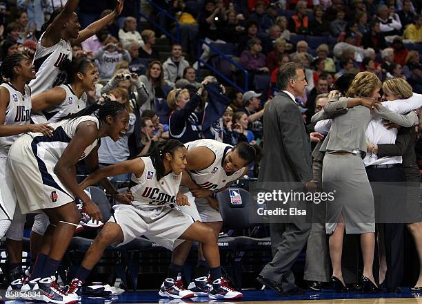 The Connecticut Huskies bench celebrates the win against the Louisville Cardinals during the NCAA Women's Final Four Championship game at the...