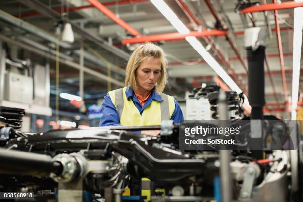 production line worker - production line worker stock pictures, royalty-free photos & images