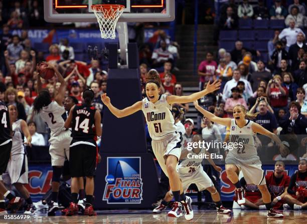 Cassie Kerns and Meghan Gardler of the Connecticut Huskies celebrate the win at the buzzer against the Louisville Cardinals during the NCAA Women's...