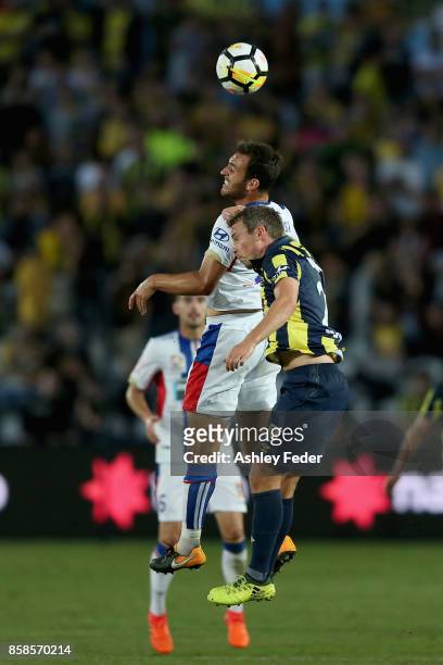 Benjamin Kantarovski of the Jets contests the ball against the Mariners defence during the round one A-League match between the Central Coast...