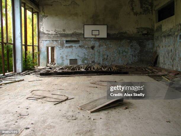 a basketball court in ruins at the chernobyl nucle - pripyat city stock pictures, royalty-free photos & images