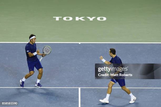 Yasutaka Uchiyama of Japan and Ben McLachlan of Japan celebrate during their men's doubles semi final match against Santiago Gonzalez of Mexico and...