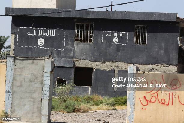 Picture shows a damaged building used as court by Islamic State group fighters in Hawija on October 6 a day after Iraqi forces retook the northern...