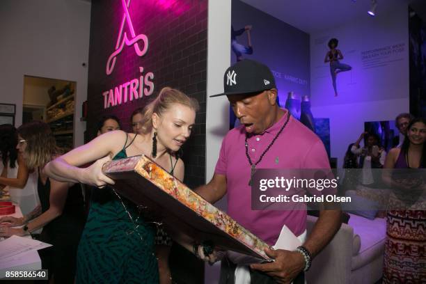 Izabella Miko and Russell Simmons attend his 60th Birthday Party at his Tantris Yoga Center on October 6, 2017 in West Hollywood, California.