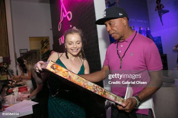 Izabella Miko and Russell Simmons attend his 60th Birthday Party at his Tantris Yoga Center on October 6, 2017 in West Hollywood, California.