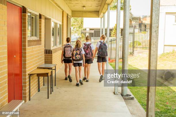 girl junior high school students arriving at school - last day of school stock pictures, royalty-free photos & images