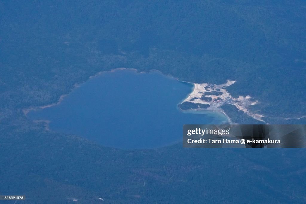 Usori lake and Mount Osore daytime aerial view from airplane