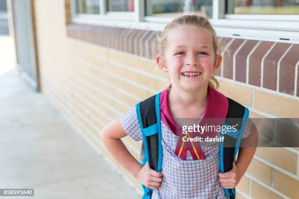 kindergarten primary school girl student arriving for class - first day of school australia stock pictures, royalty-free photos & images