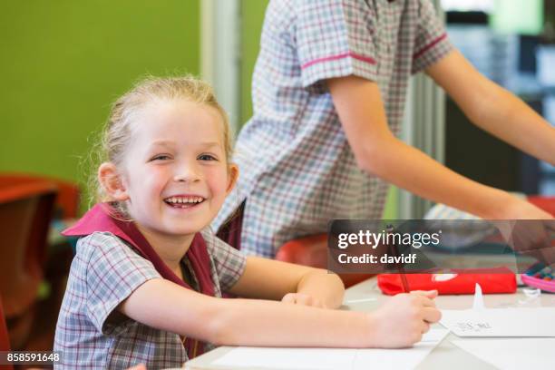 kindergarten primary school girl student at her first day of class - first day of school australia stock pictures, royalty-free photos & images