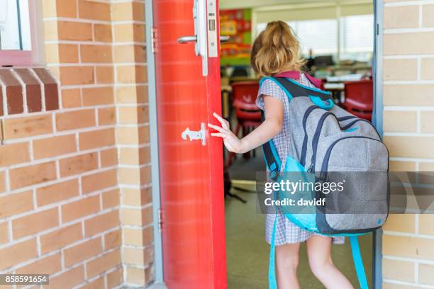 kindergarten primary school girl student arriving for class - first day of school australia stock pictures, royalty-free photos & images