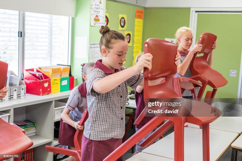 Primary School Students Putting Up Chairs at the End of Class