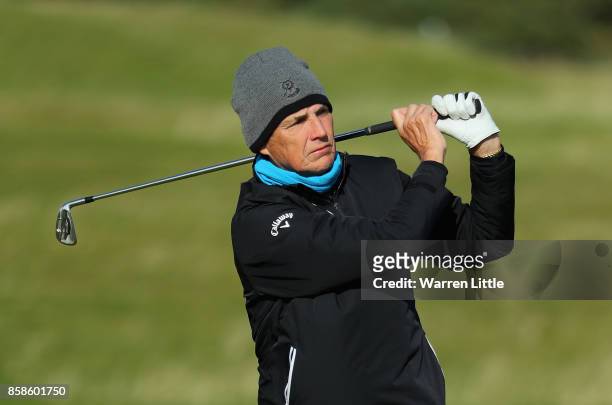 Former footballer Alan Hansen plays his second shot on the 14th during day three of the 2017 Alfred Dunhill Championship at The Old Course on October...