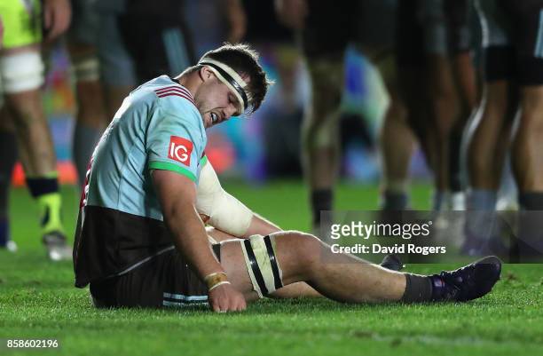 Jack Clifford of Harlequins sits on the pitch after dislocating his arm during the Aviva Premiership match between Harlequins and Sale Sharks Sharks...