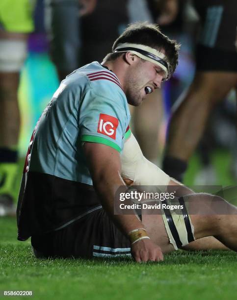 Jack Clifford of Harlequins sits on the pitch after dislocating his arm during the Aviva Premiership match between Harlequins and Sale Sharks Sharks...