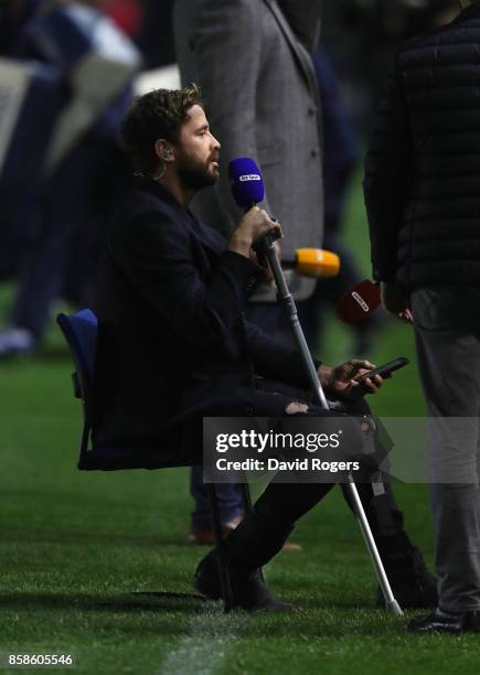 Danny Cipriani, the Wasps standoff, sits as he conducts television work while he's out of the game for weeks with a leg injury during the Aviva...