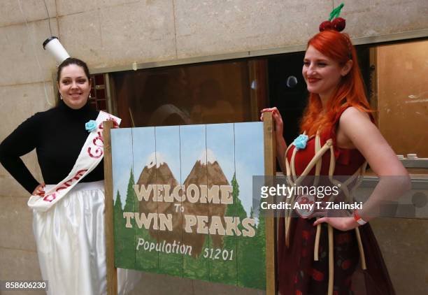 Tanya Baikova and Nadia Samorokova from Latvia pose in costume in front of the Welcome to Twin Peaks sign during the Twin Peaks UK Festival 2017 at...