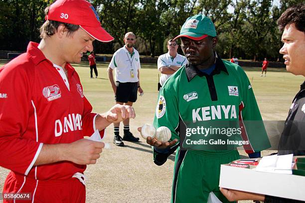 Captains Frederik Klokker of Denmark & Steve Tikolo of Kenya select the balls with 3rd umpire Buddhi Pradhan during the ICC Mens Cricket World Cup...