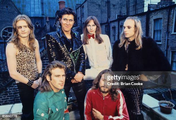 Paul Thompson, Bryan Ferry, Rik Kenton, Brian Eno, Andy Mackay, Phil Manzanera, Roxy Music posed group shot from studio photo shoot in West London on...