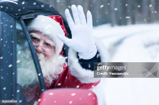 santa claus at car - christmas driving stock pictures, royalty-free photos & images