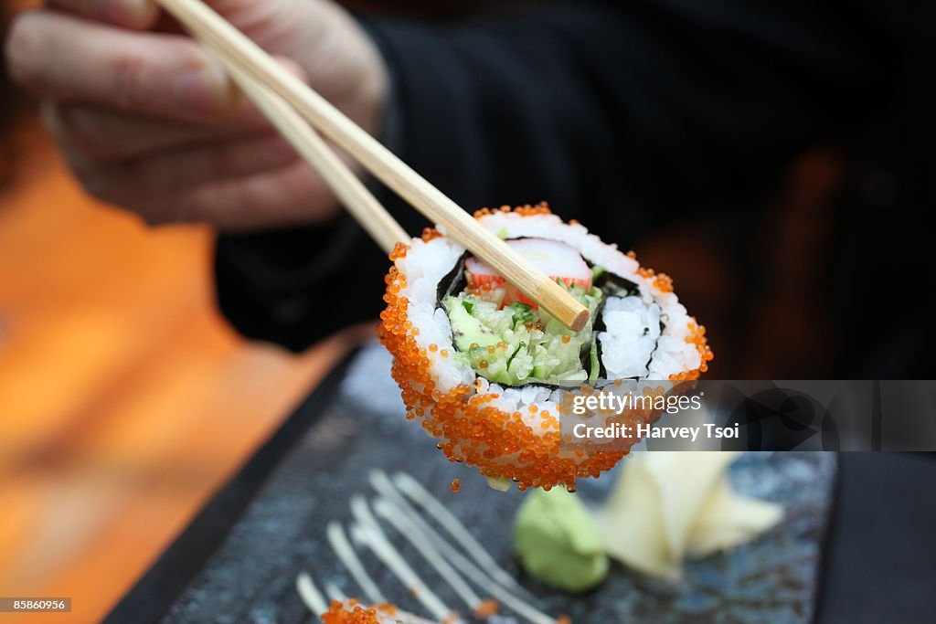 Chopsticks Holding Sushi