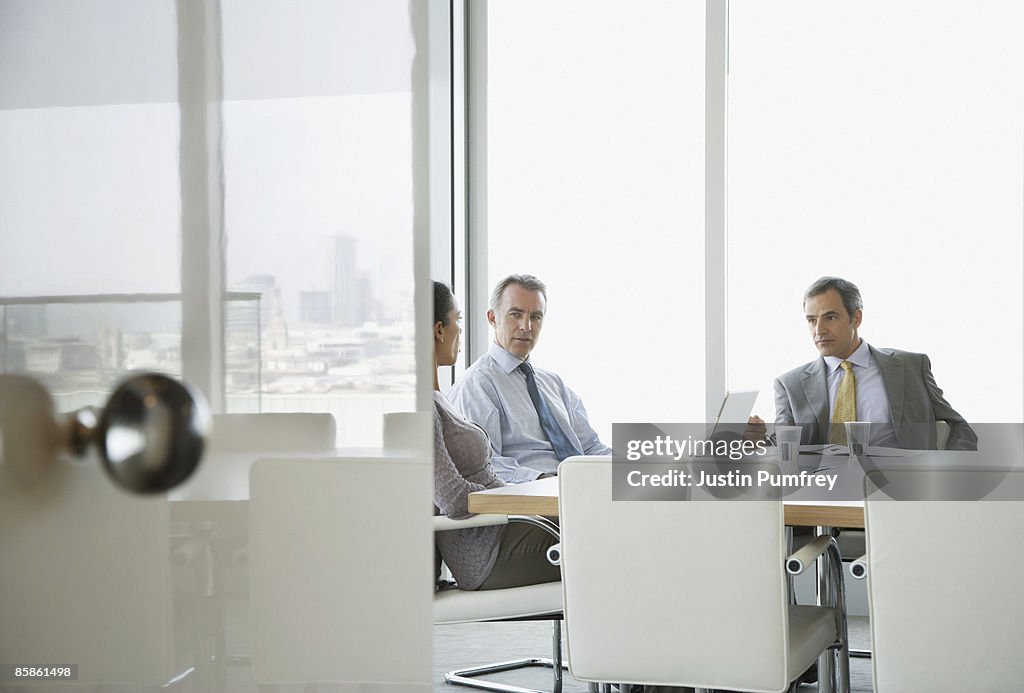 Three business people in a meeting 