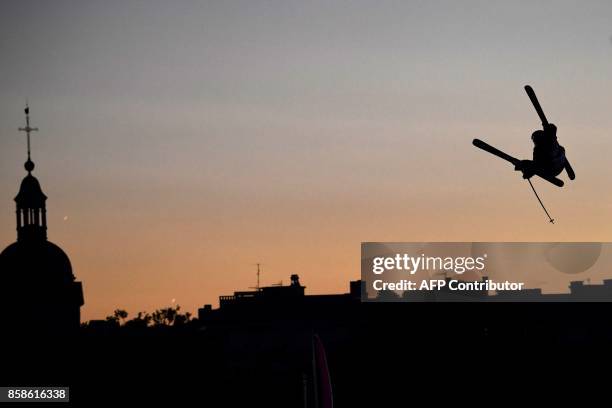 Freestyle skier perofrms in the Sosh Big Air, a competition of freestyle skiers and snowboarders, in Annecy, at sunset on October 6, 2017 as part of...