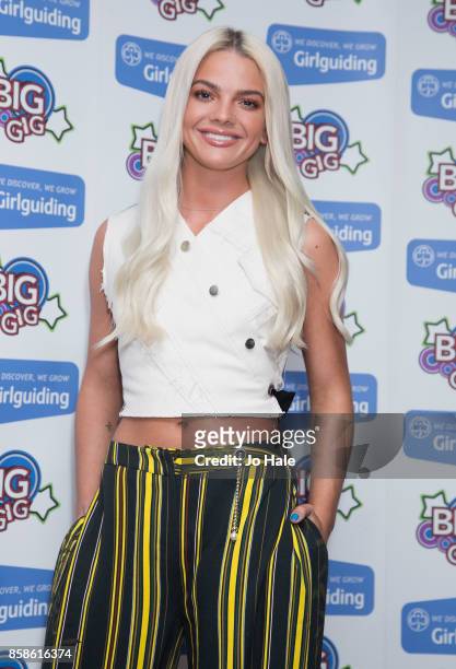 Louisa Johnson poses by boards at Girlguiding UK's Big Gig at SSE Arena on October 7, 2017 in London, England.