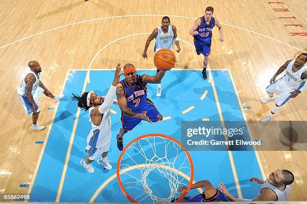 Al Harrington of the New York Knicks lays up a shot against Renaldo Balkman of the Denver Nuggets during the game on March 31, 2009 at the Pepsi...