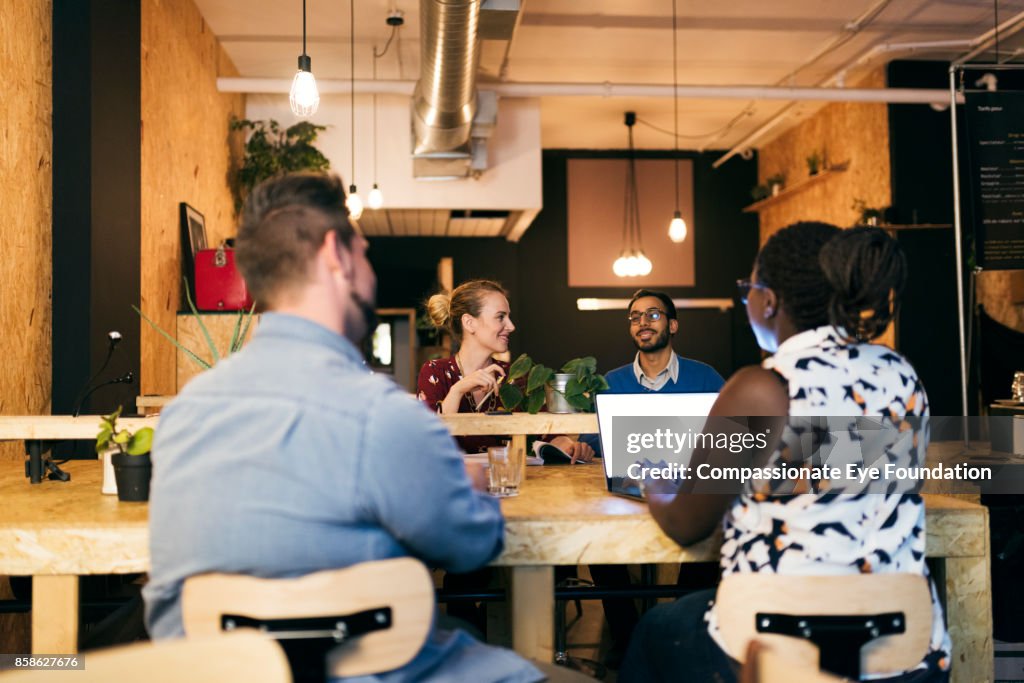 Business people having meeting in cafe