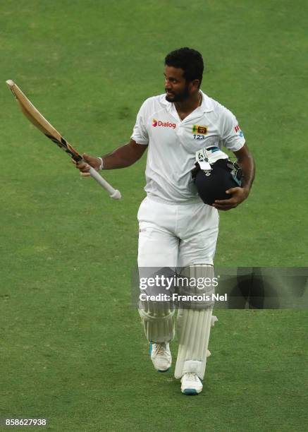 Dimuth Karunaratne of Sri Lanka leaves the filed after being dismissed by Wahab Riaz of Pakistan during Day Two of the Second Test between Pakistan...