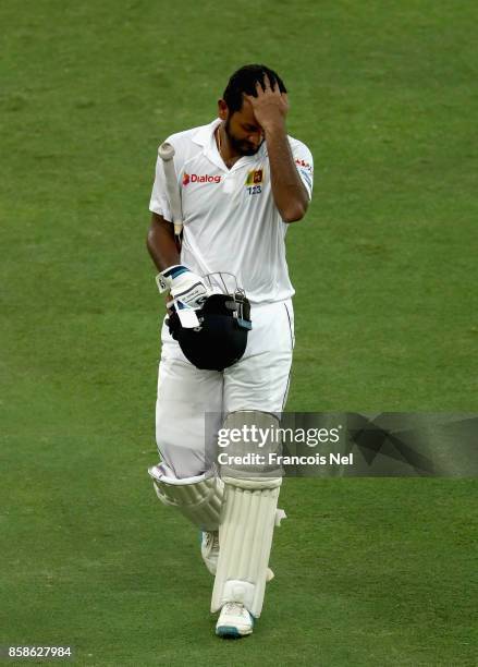 Dimuth Karunaratne of Sri Lanka leaves the filed after being dismissed by Wahab Riaz of Pakistan during Day Two of the Second Test between Pakistan...