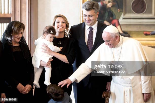 Pope Francis meets Croatia's Prime Minister Andrej Plenkovic and his family during an audience at the Apostolic Palace on October 7, 2017 in Vatican...