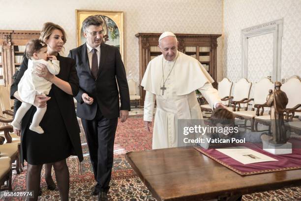 Pope Francis meets Croatia's Prime Minister Andrej Plenkovic, his family and his delegation during an audience at the Apostolic Palace on October 7,...