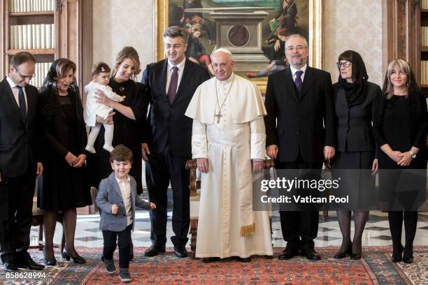 Pope Francis meets Croatia's Prime Minister Andrej Plenkovic, his family and his delegation during an audience at the Apostolic Palace on October 7,...