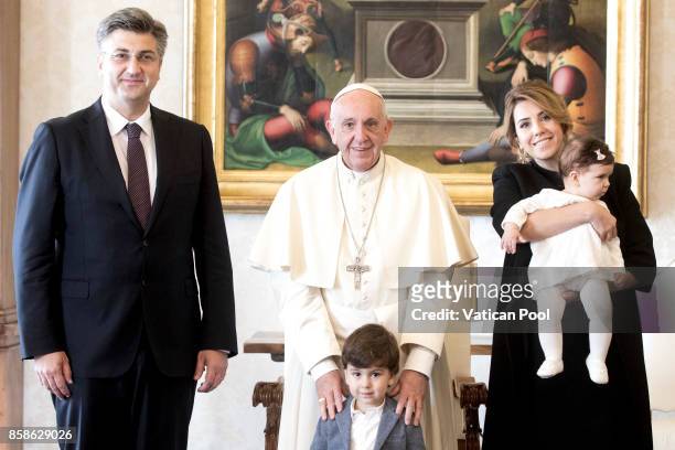 Pope Francis meets Croatia's Prime Minister Andrej Plenkovic, his family and his delegation during an audience at the Apostolic Palace on October 7,...