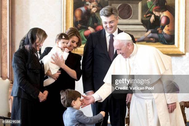 Pope Francis meets Croatia's Prime Minister Andrej Plenkovic and his family during an audience at the Apostolic Palace on October 7, 2017 in Vatican...