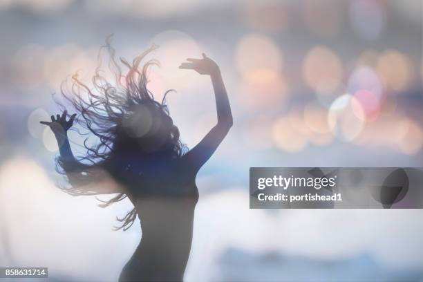 silhouette of female - trance music stock pictures, royalty-free photos & images