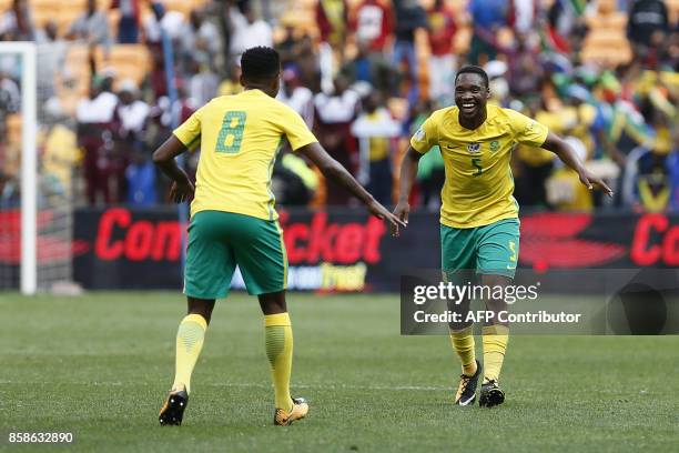 South Africa's Sibusiso Vilakazi celebrates his goal with his teammate Bongani Zungu during the World Cup 2018 qualifier football match between South...