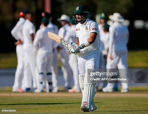 Bangladesh's batsman Sabbir Rahman reacts as he walks back to the pavilion after his dismissal by South Africa's bowler Kagiso Rabada during the...