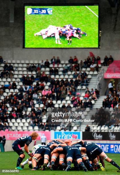 Stade Francais's South African scrum-half Charl McLeod puts the ball into the scrum during the Top14 rugby union match between Stade Français and...