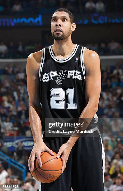 Tim Duncan of the San Antonio Spurs shoots a free throw during the game against the New Orleans Hornets on March 29, 2009 at the New Orleans Arena in...