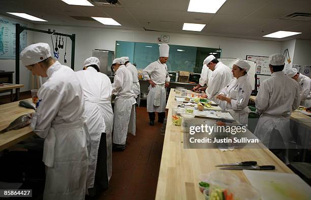 Culinary instructor Chef Matt Cosenza looks over a butchery class at the Le Cordon Bleu program at California Culinary Academy April 8, 2009 in San...