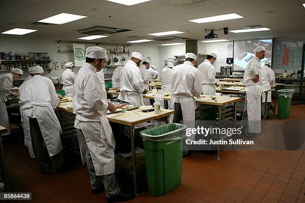 Culinary students do prep work for a meal during a butchery class at the Le Cordon Bleu program at California Culinary Academy April 8, 2009 in San...