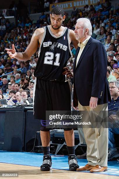 Tim Duncan and head coach Gregg Popovich of the San Antonio Spurs talk during the game against the New Orleans Hornets on March 29, 2009 at the New...