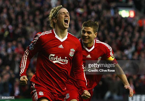 Fernando Torres of Liverpool celebrates scoring the opening goal with team mate Steven Gerrard during the UEFA Champions League Quarter Final First...