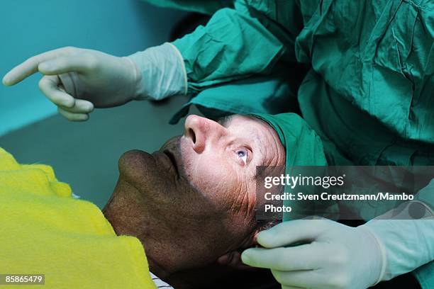 Patient listens to instructions from surgeons prior to his cataract surgery at Cuba's and Venezuela's joint program 'Operacion Milagro,' Operation...