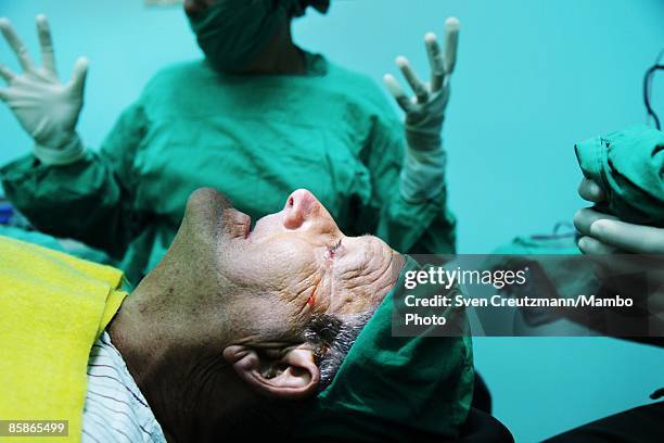 Patient listens to instructions from surgeons prior to his cataract surgery at Cuba's and Venezuela's joint program 'Operacion Milagro,' Operation...