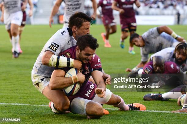 Bordeaux-Begles' French centre Jean-Baptiste Dubie scores a try during the French Top 14 rugby union match between Bordeaux-Begles and Toulon on...