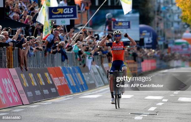 Italy's Vincenzo Nibali from the Bahrain-Merida team gestures as he celebrates victory while crossing the finish line of the 111th edition of The...